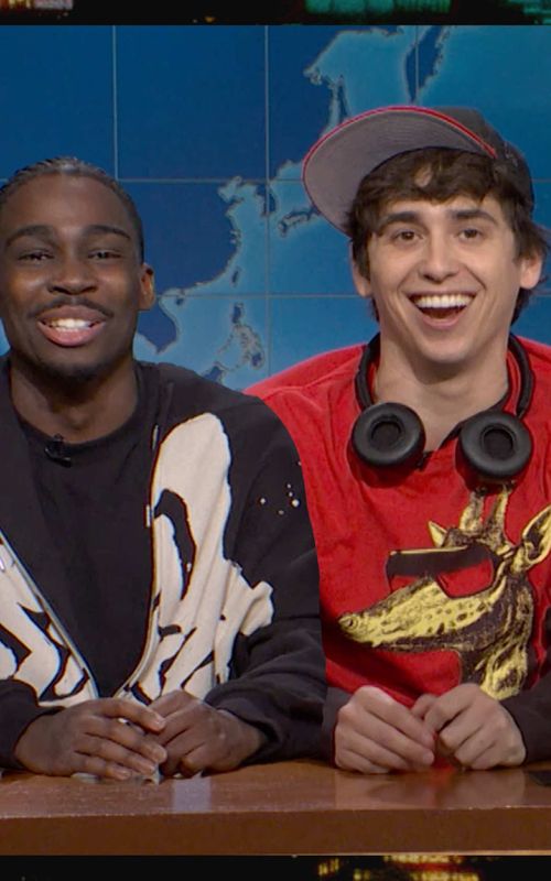 two kids from the back of the school bus are at the desk